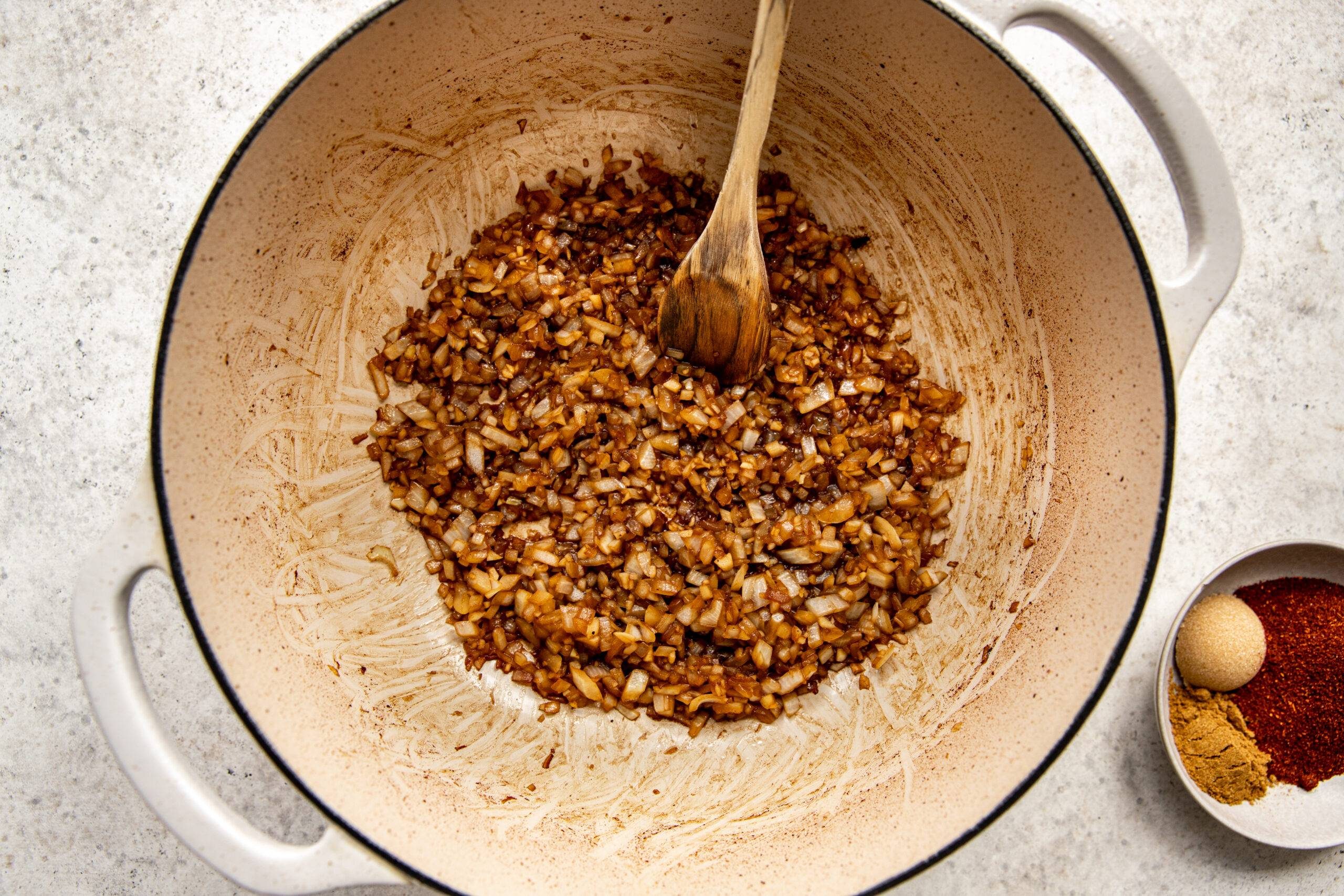 Browning onion and garlic in a pan.