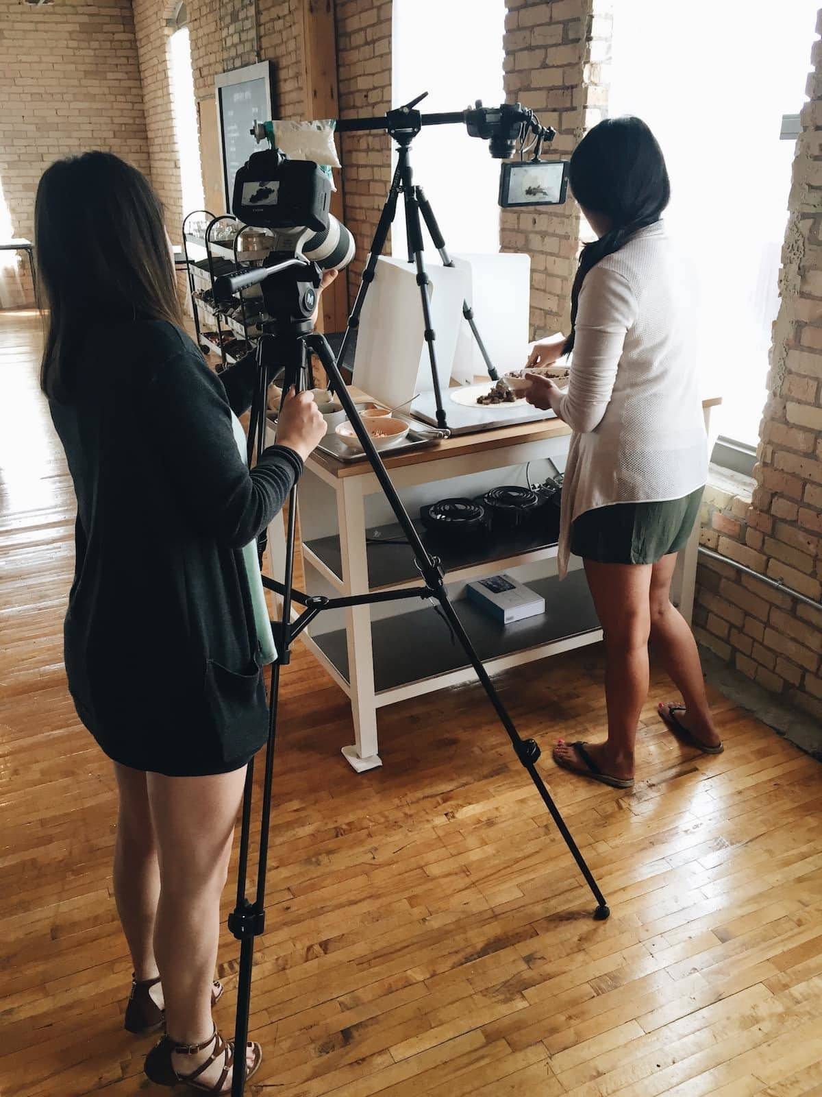 women filming a food video