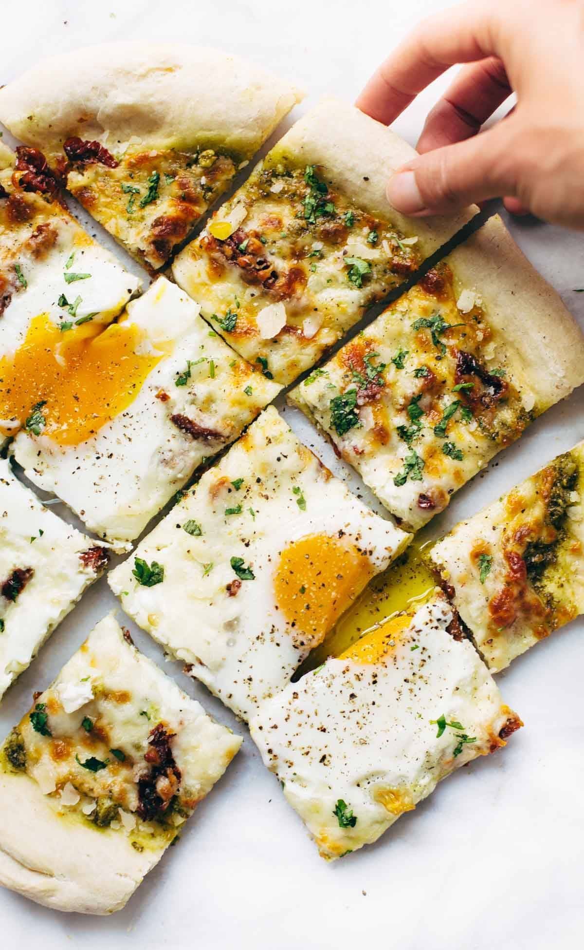 Breakfast Pizza cut into squares.