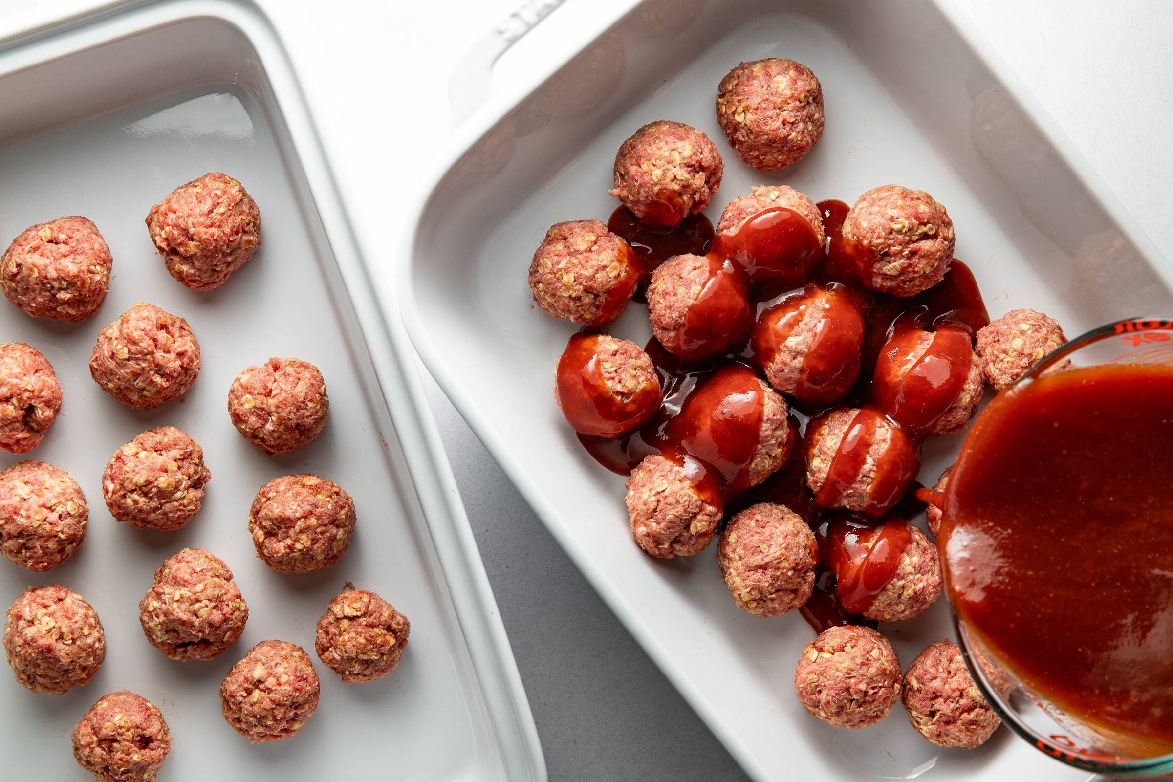 Covering meatballs with bbq sauce.