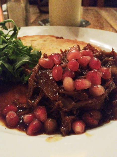 lamb shoulder on toast with pomegrante seeds at The Old Dairy lamb shoulder on toast with pomegrante seeds at the old dairy