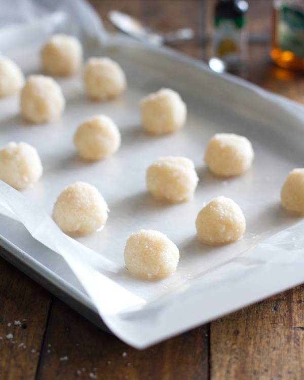 Coconut bites on parchment paper.