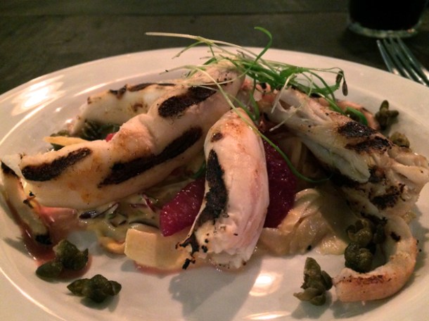 charred octopus with kimchee, blood orange and capers at q grill