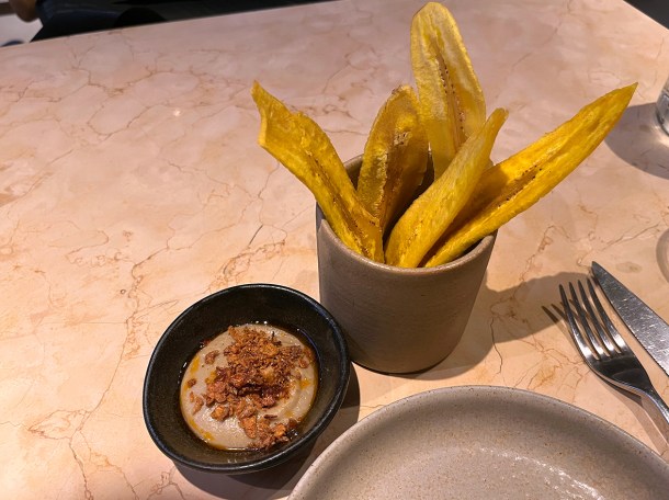 illustrative photo of the green plantain chips with aubergine yassa at Akara