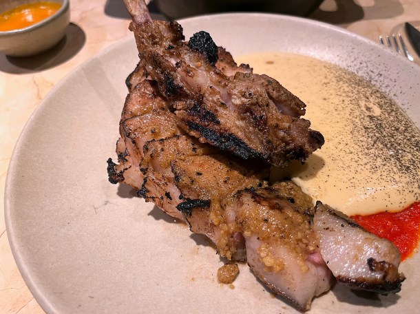 illustrative photo of the grilled pork with yam sauce and chilli at Akara