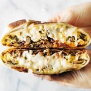 Breakfast Crunchwrap held in a hand.