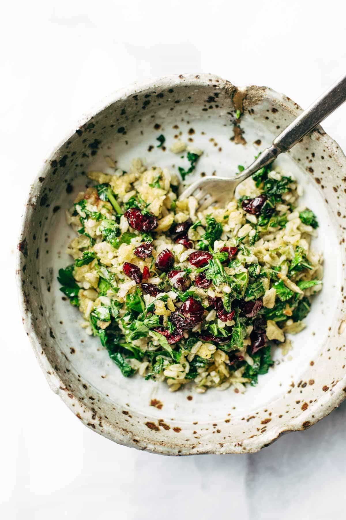 Garlic Kale and Brown Rice Salad with a zippy lemon herb dressing! This side dish recipe is so simple and it compliments almost any main dish! | pinchofyum.com