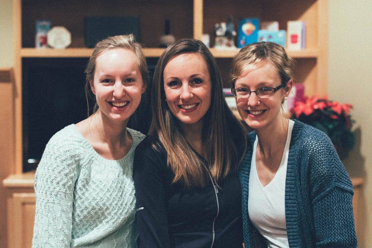 Three women smiling.