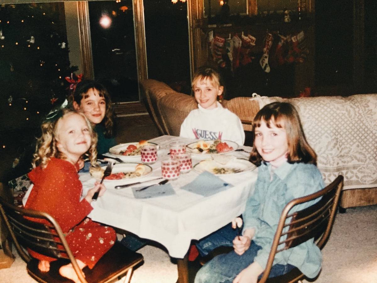 Young girls sitting at a table.