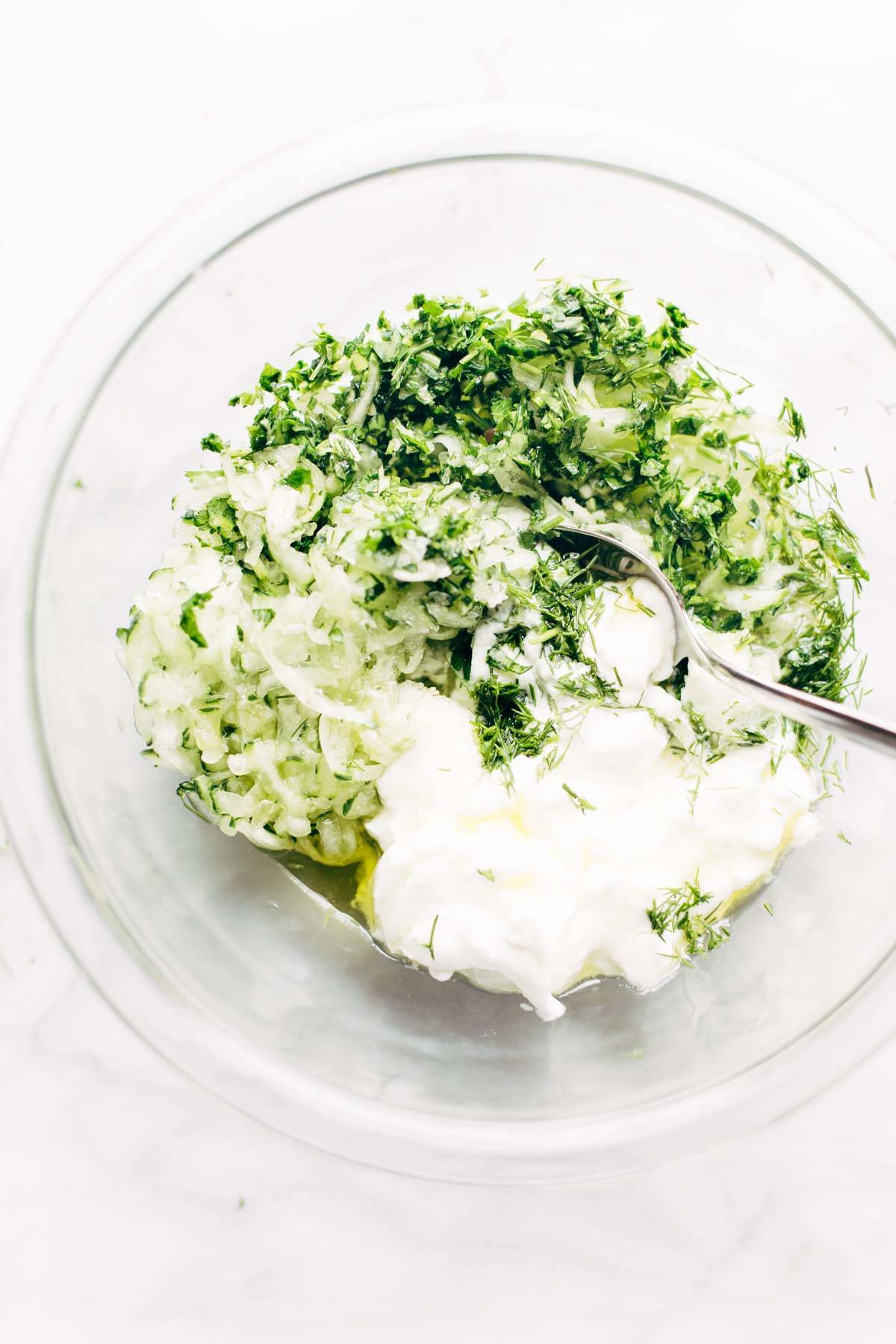 Loaded Mediterranean Street Fries ingredients in a bowl.