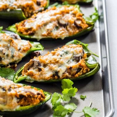 Queso Stuffed Poblanos on a sheet pan.