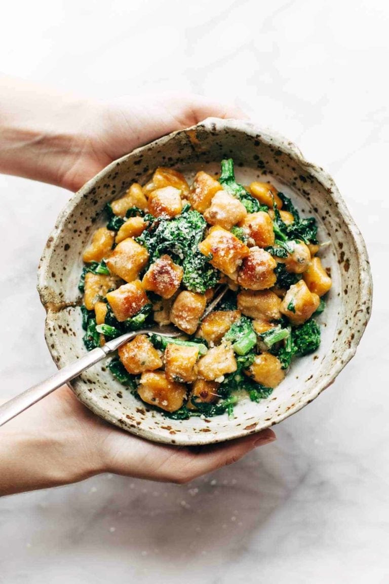 Sweet potato gnocchi in a bowl with broccoli rabe.